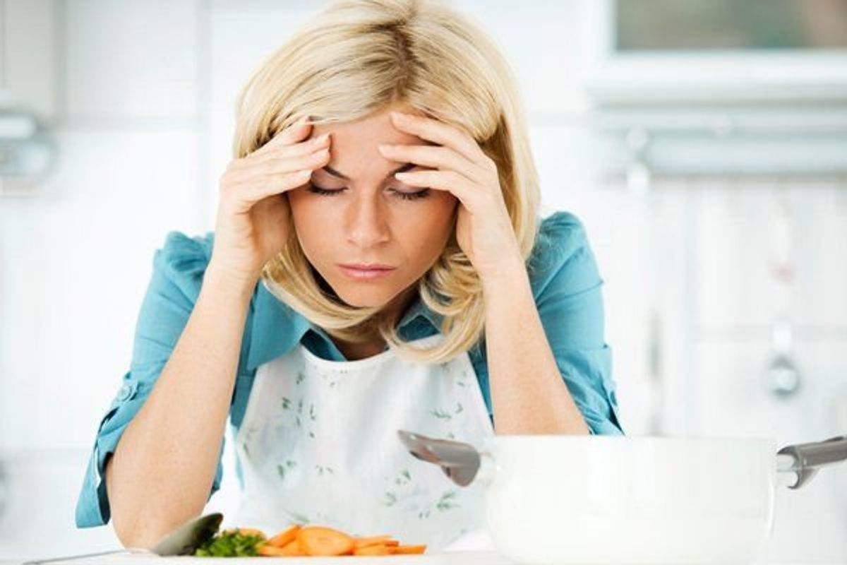 woman stressed out while cooking