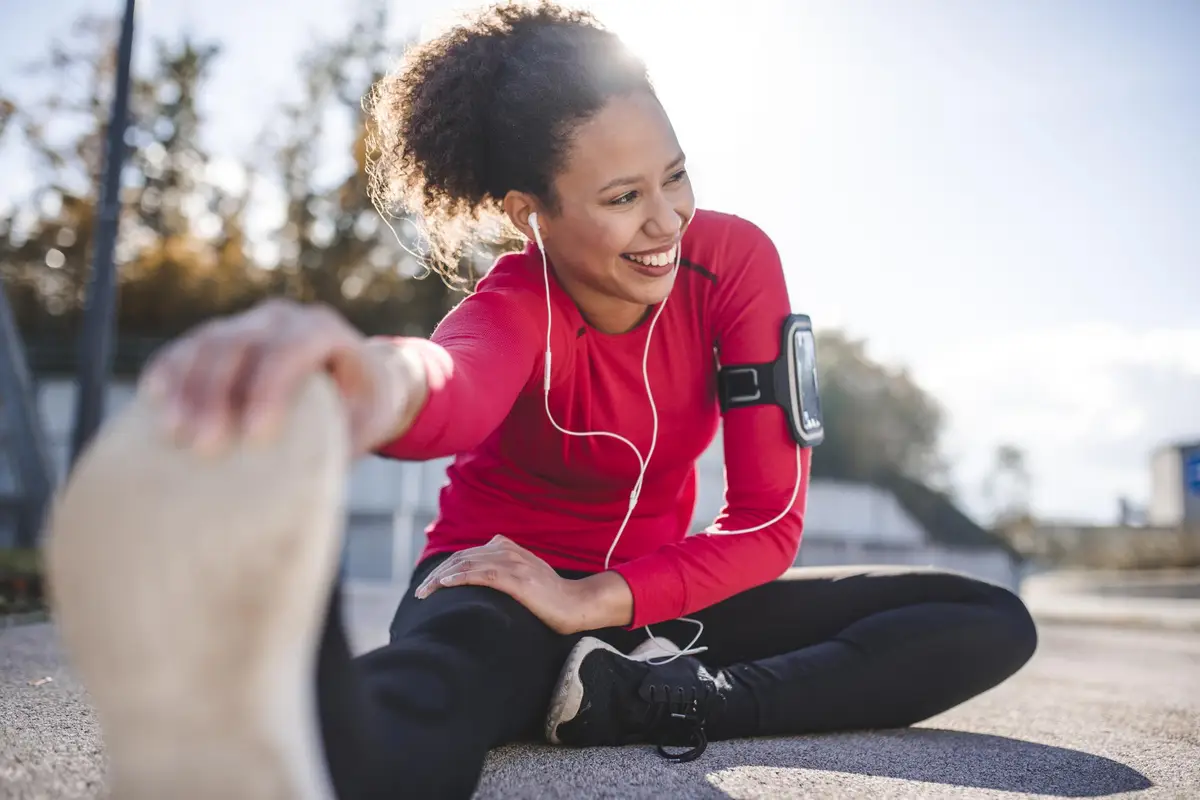 Woman stretching ham strings before a run