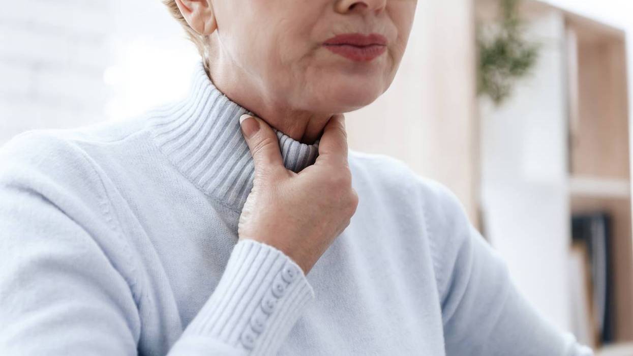 woman suffering from EOE with throat pain
