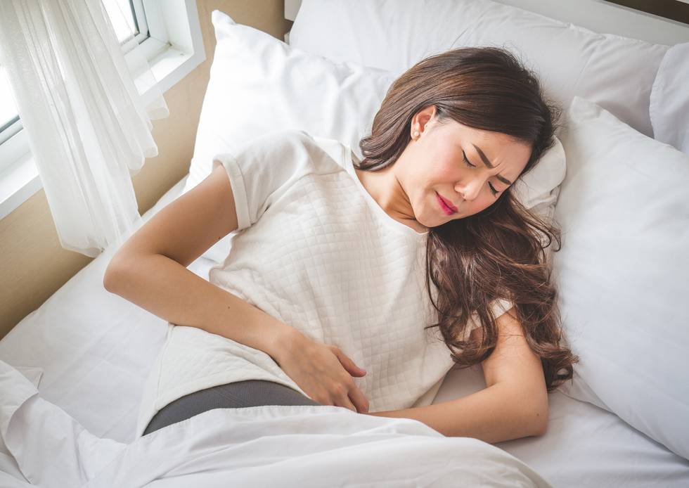 woman suffering from heavy periods