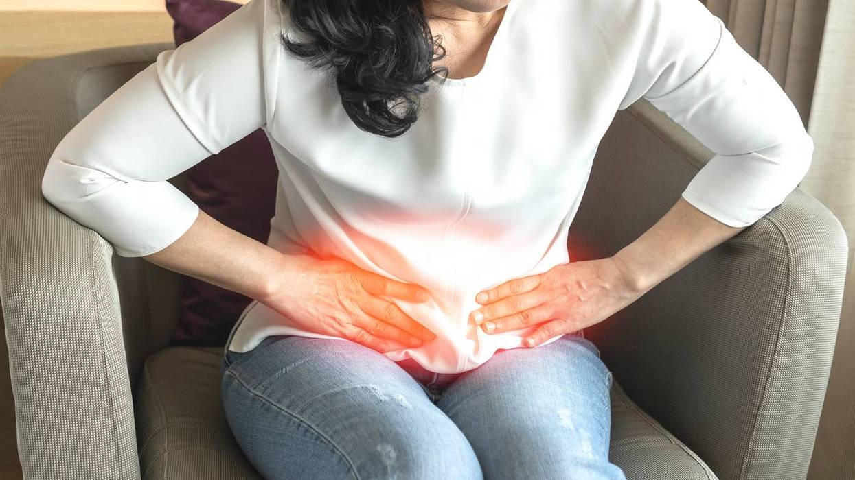 woman suffering from kidney pain, Hyperoxaluria