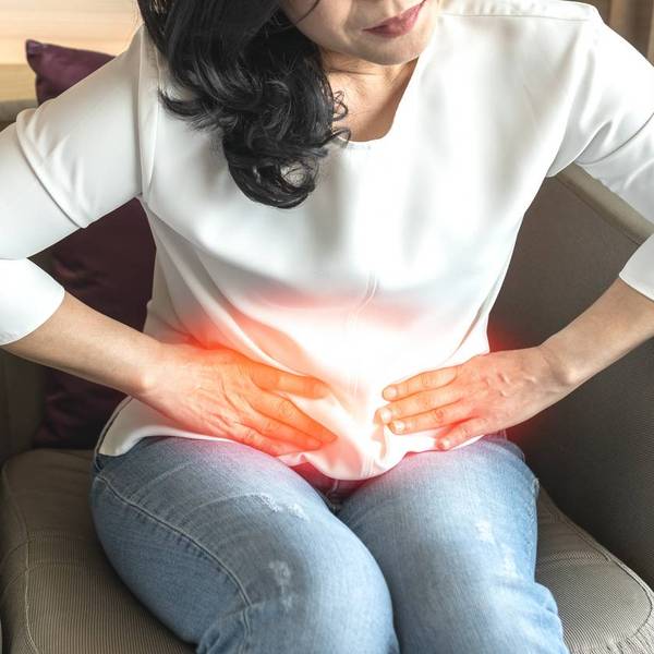 woman suffering from kidney pain, Hyperoxaluria