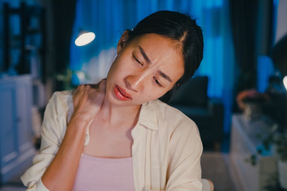 woman suffering from pain caused by fibromyalgia