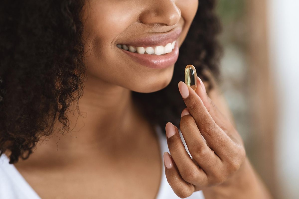 woman taking a vitamin