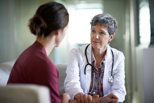 woman talking to her doctor about pelvic organ prolapse