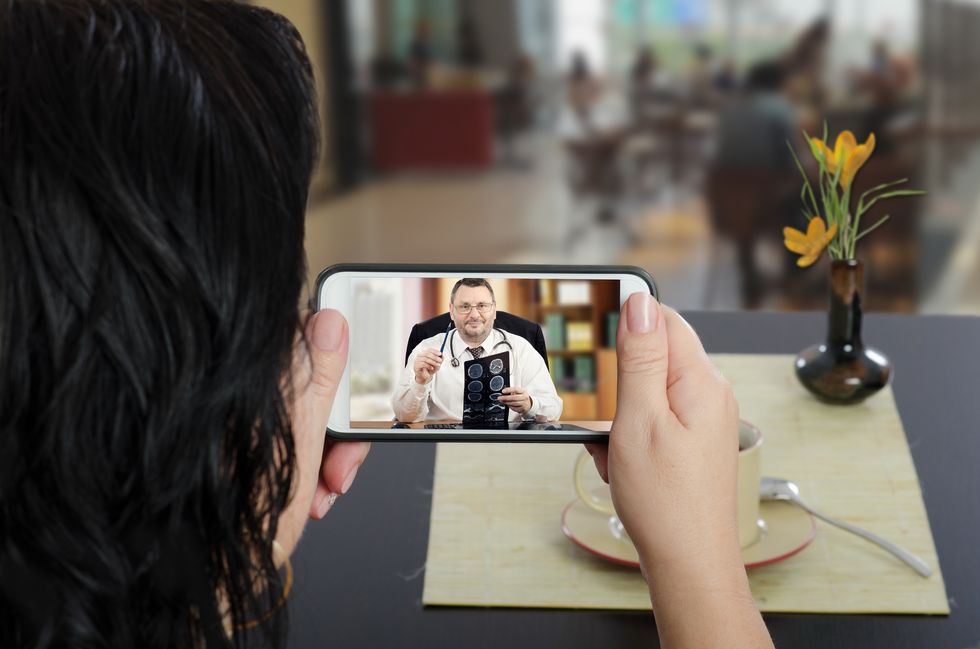 woman talking with her doctor via telemedicine