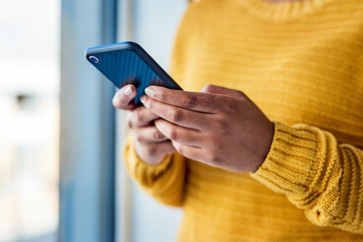 woman using a mobile phone indoors