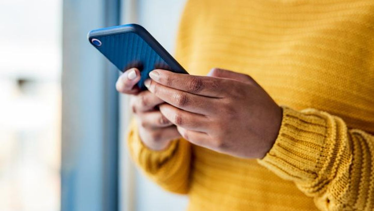 woman using a mobile phone indoors