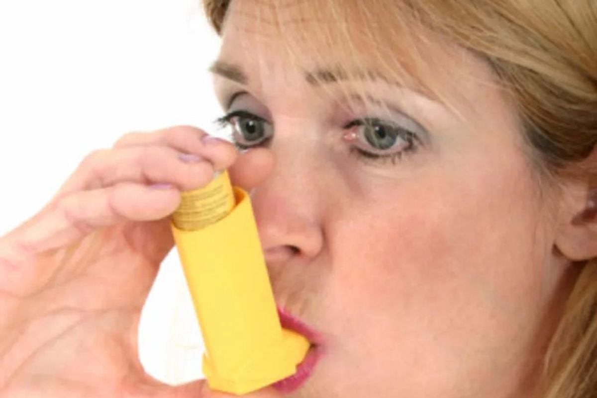 woman using an inhaler