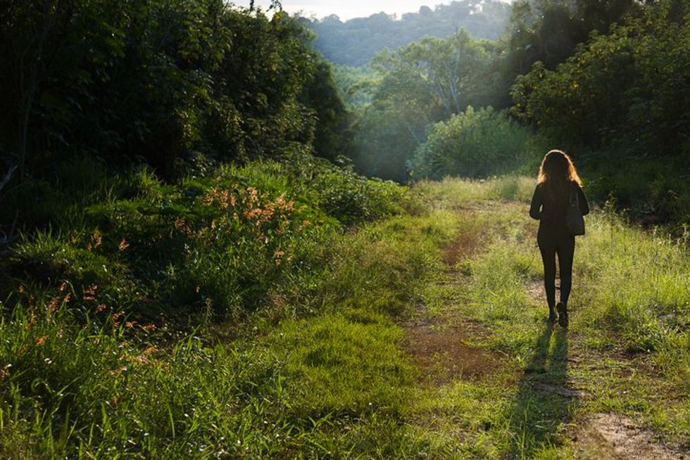 woman walking in the forest