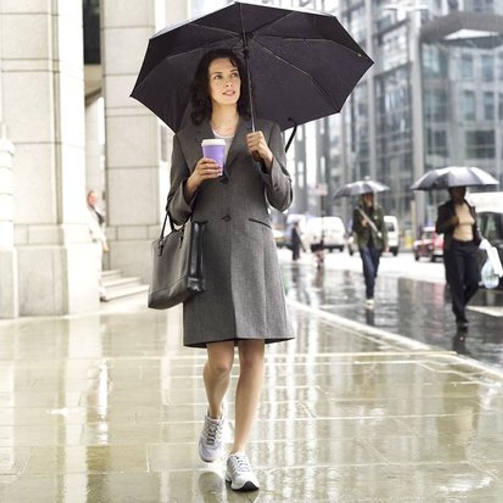 woman walking in the rain