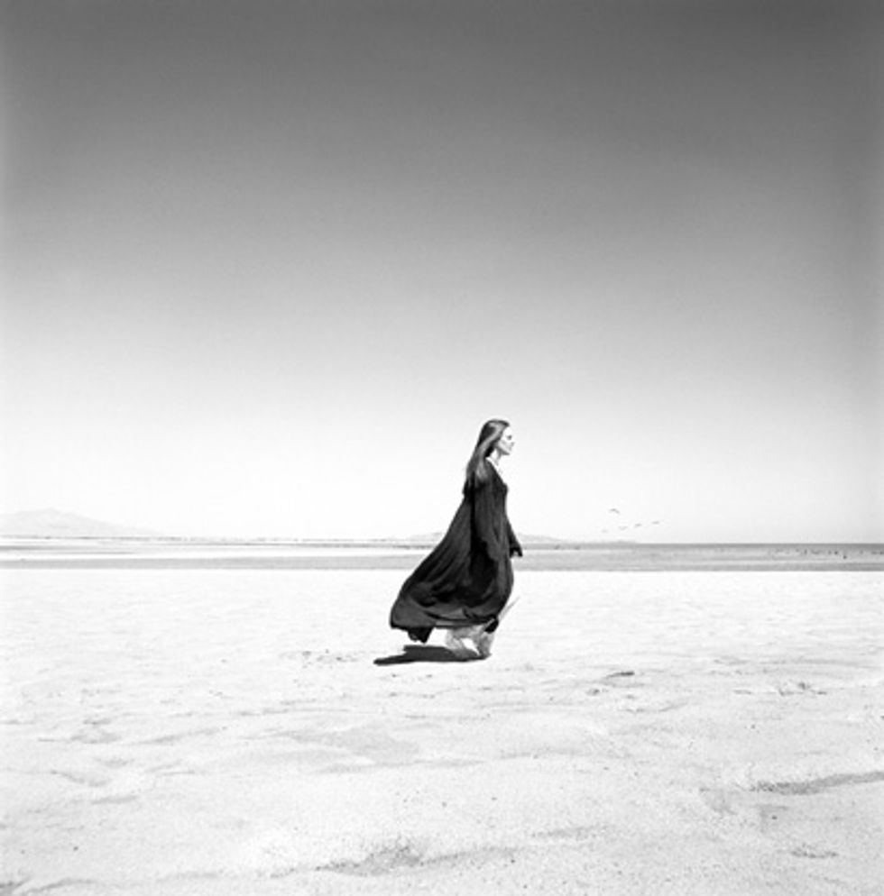 woman walking on sand