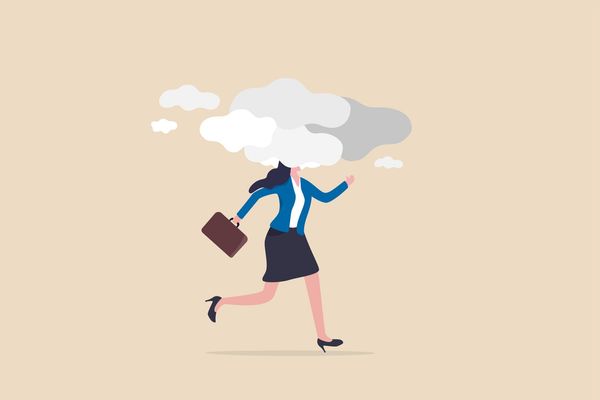 woman walking with clouds surrounding her head