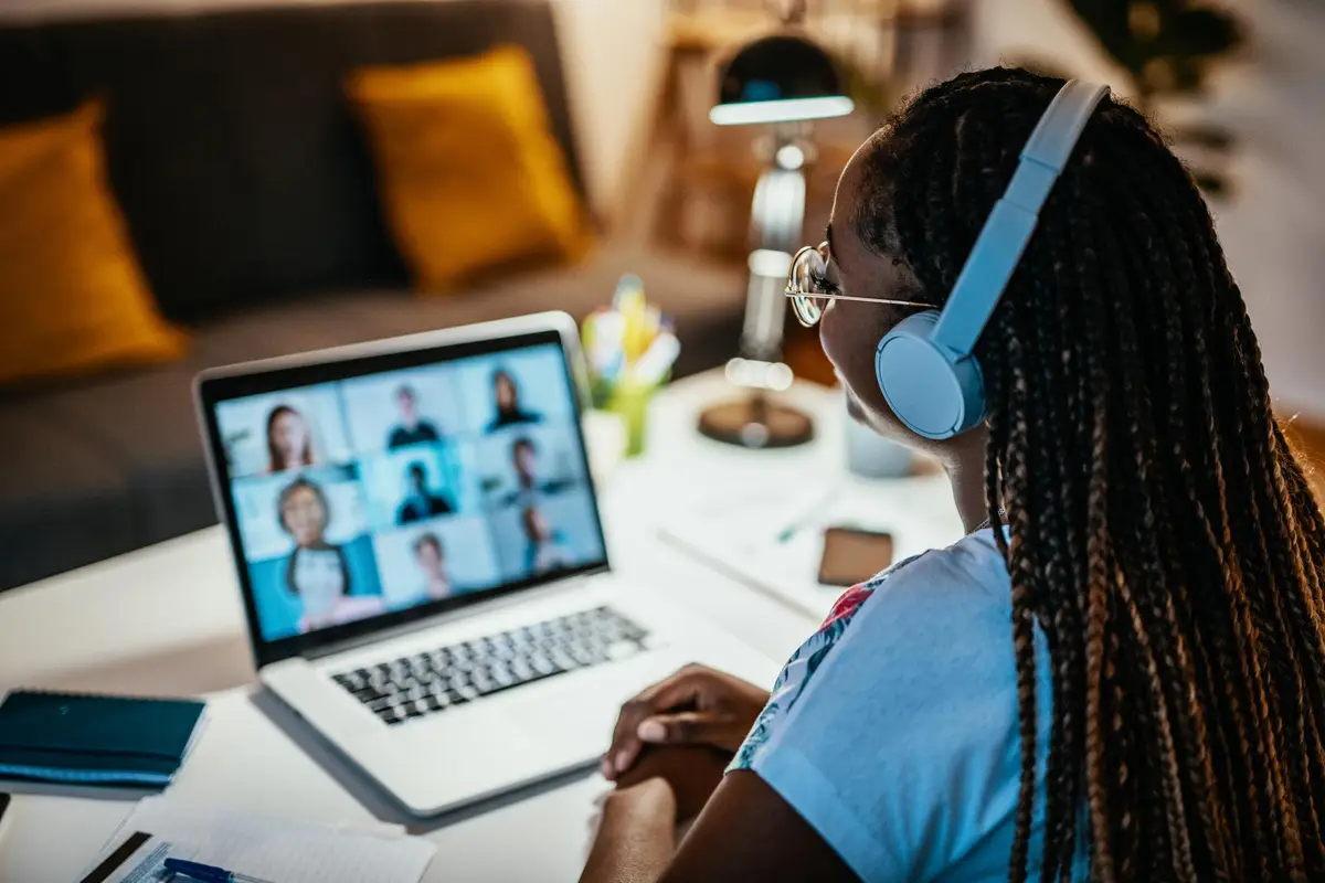 woman watching a webinar on her laptop