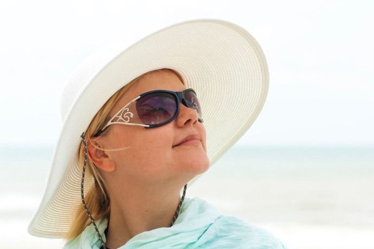 woman wearing a sun hat