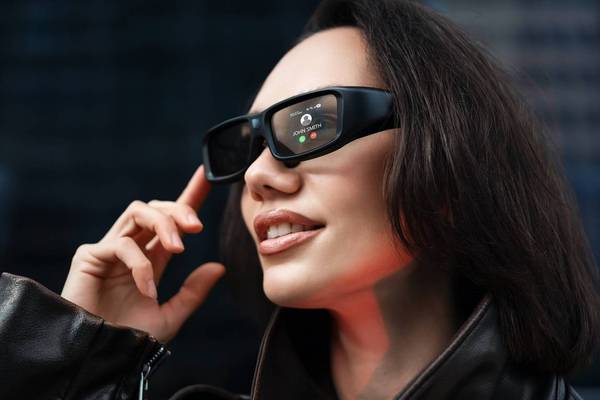 woman wearing futuristic smart glasses