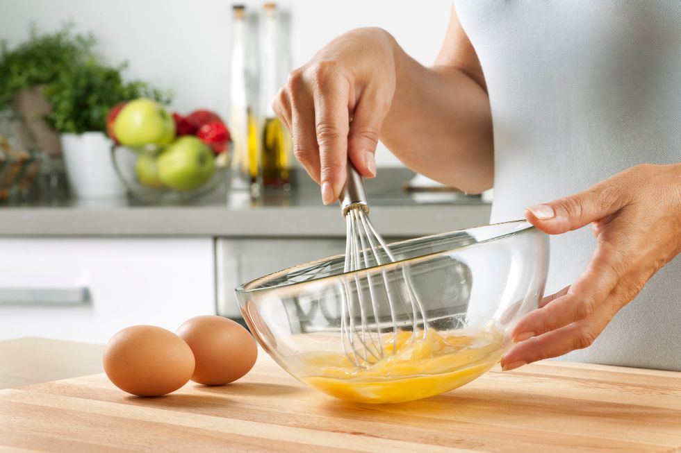 woman whisking eggs