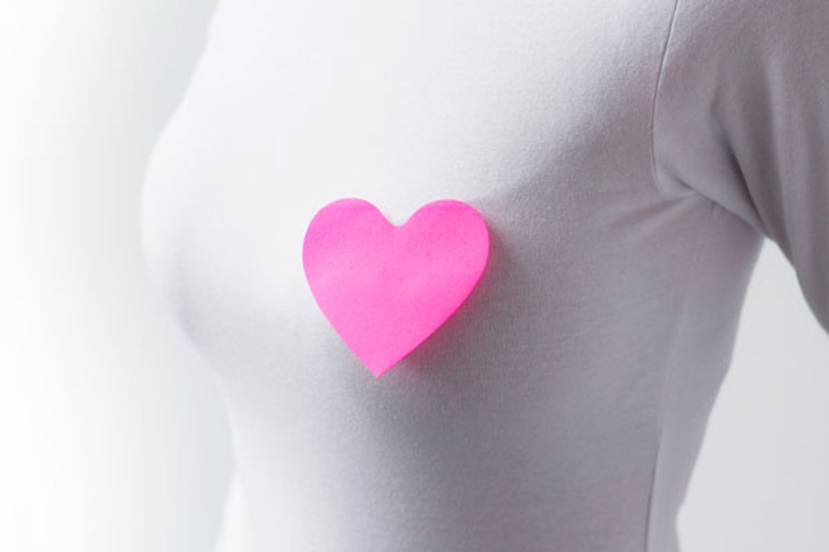woman with a cut out of a heart on her chest
