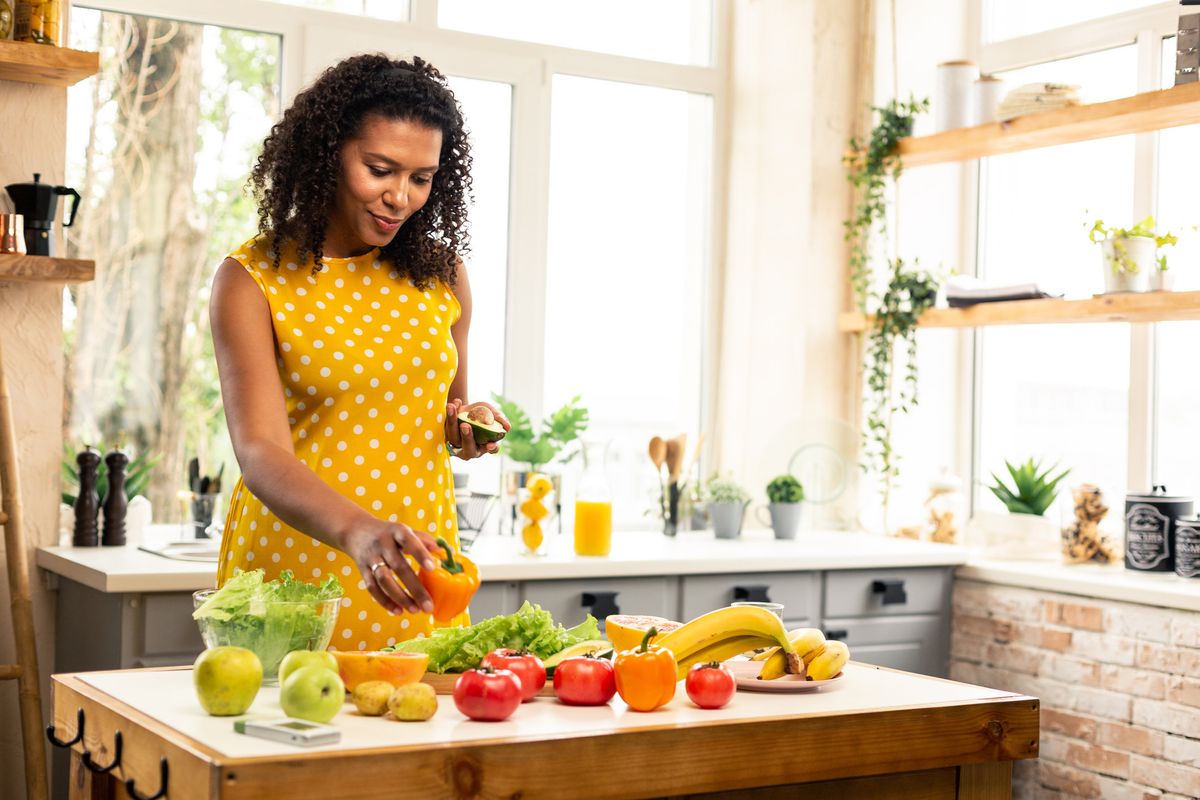woman with a table full of produce