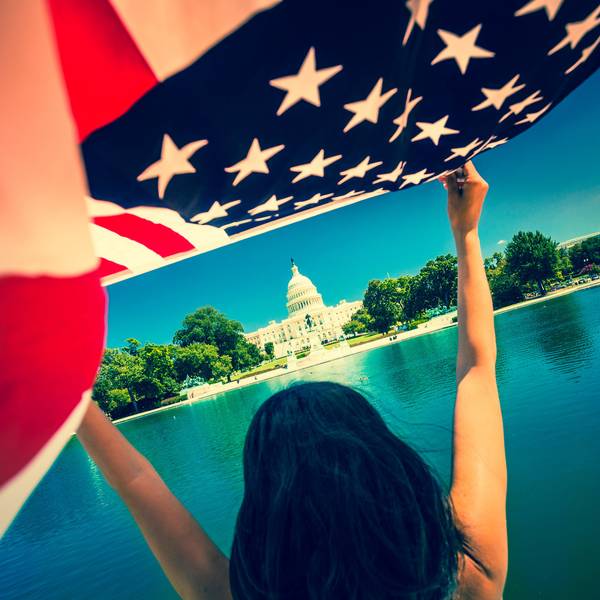 Woman with American Flag at Capitol Hill Building in Washington