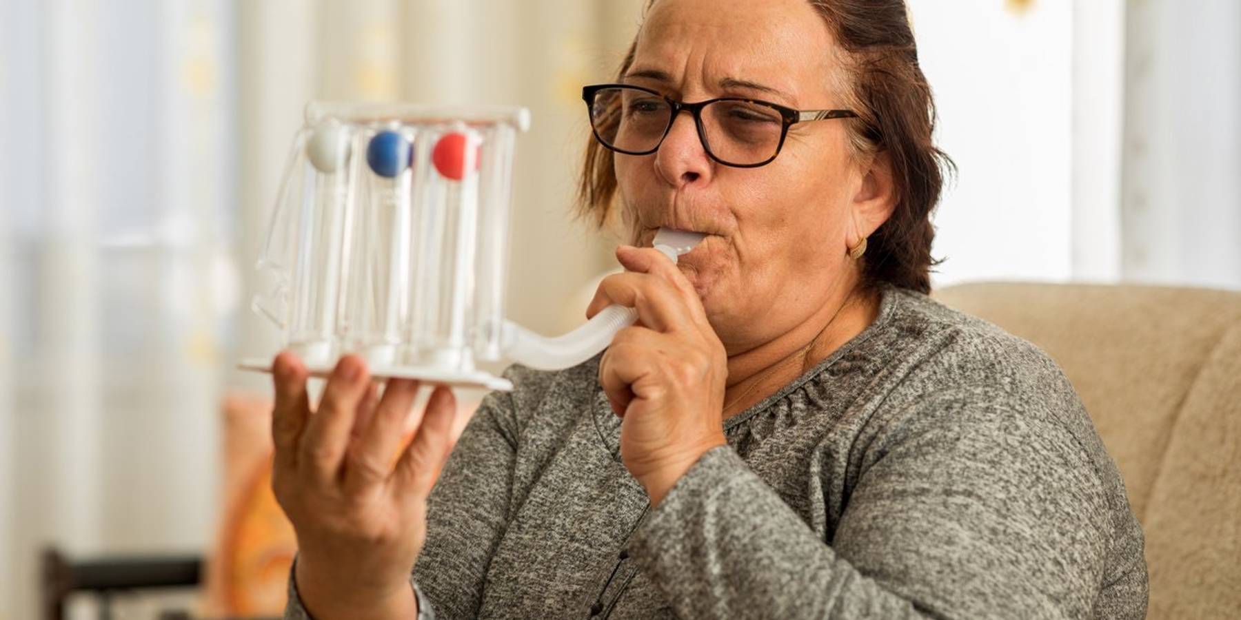woman with breathing problems at home