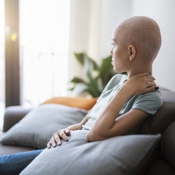 Woman with cancer contemplating and relaxing at home