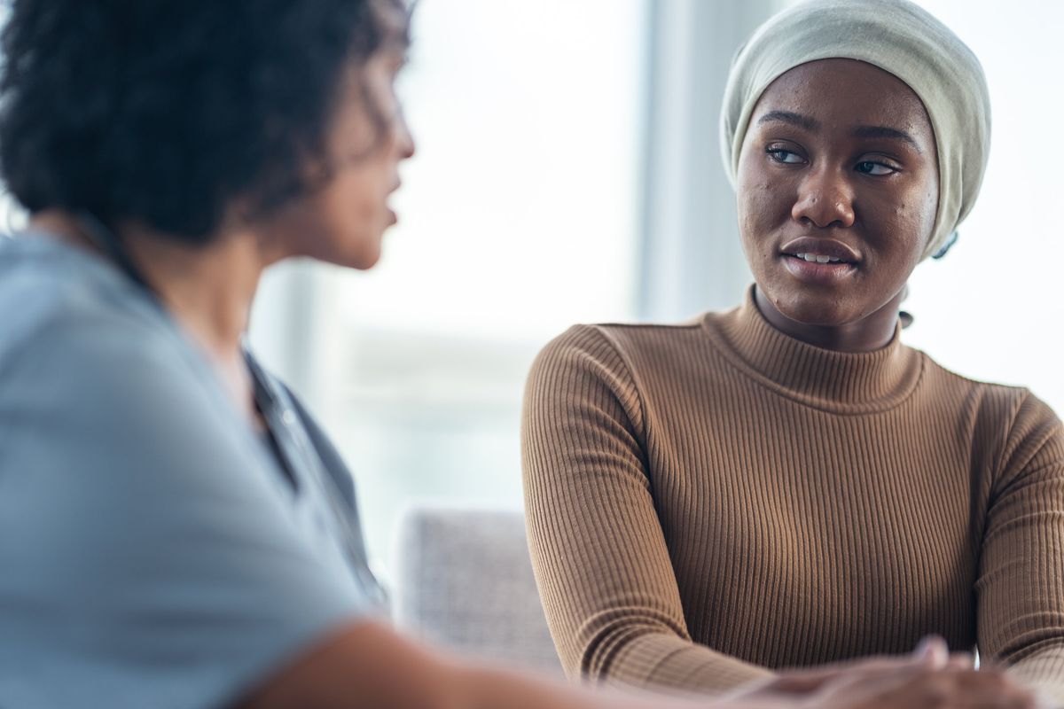 Woman with cancer meeting with female physician