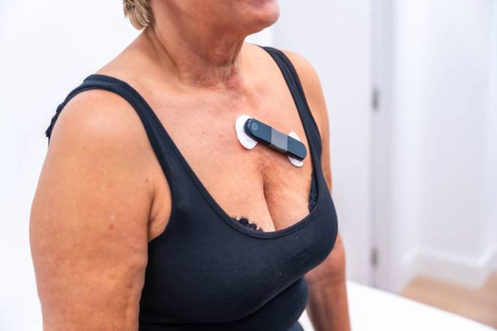 Woman with cardiac problems undergoing a Holter monitor test