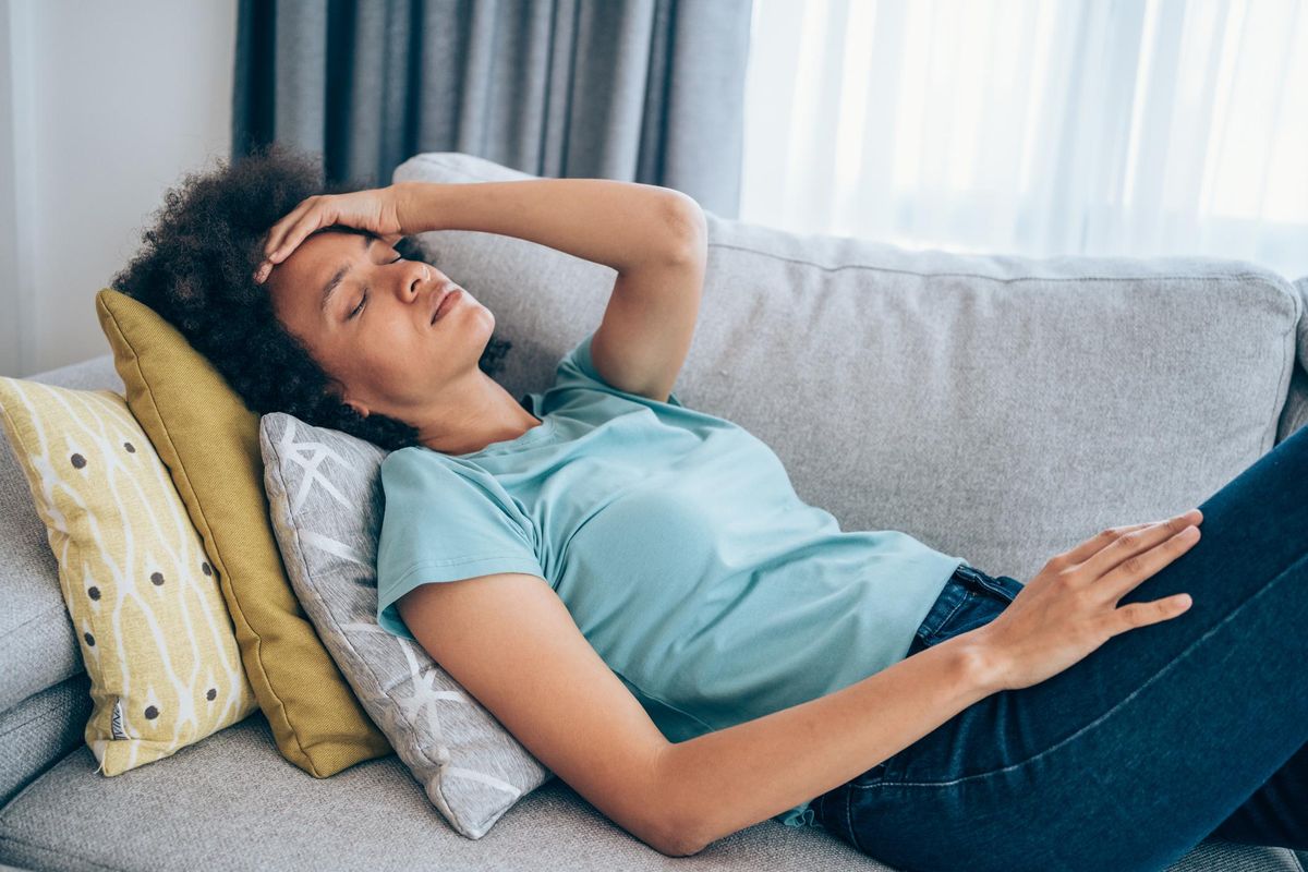 Woman with high fever at home