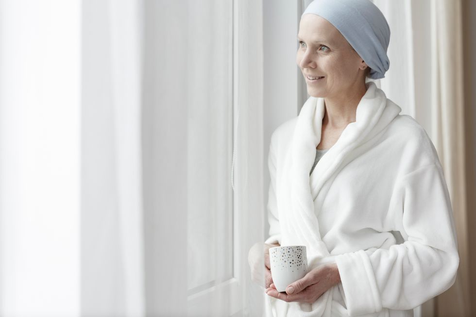 woman with ovarian cancer in bathrobe while in the hospital
