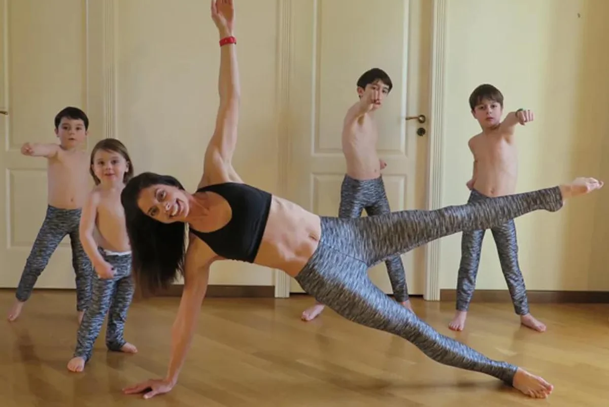 woman working out with her 4 kids