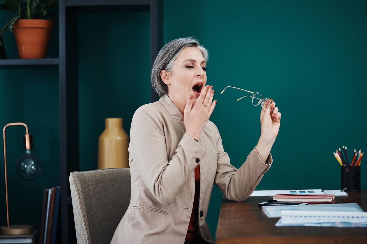 woman yawning because she suffers from sleep apnea