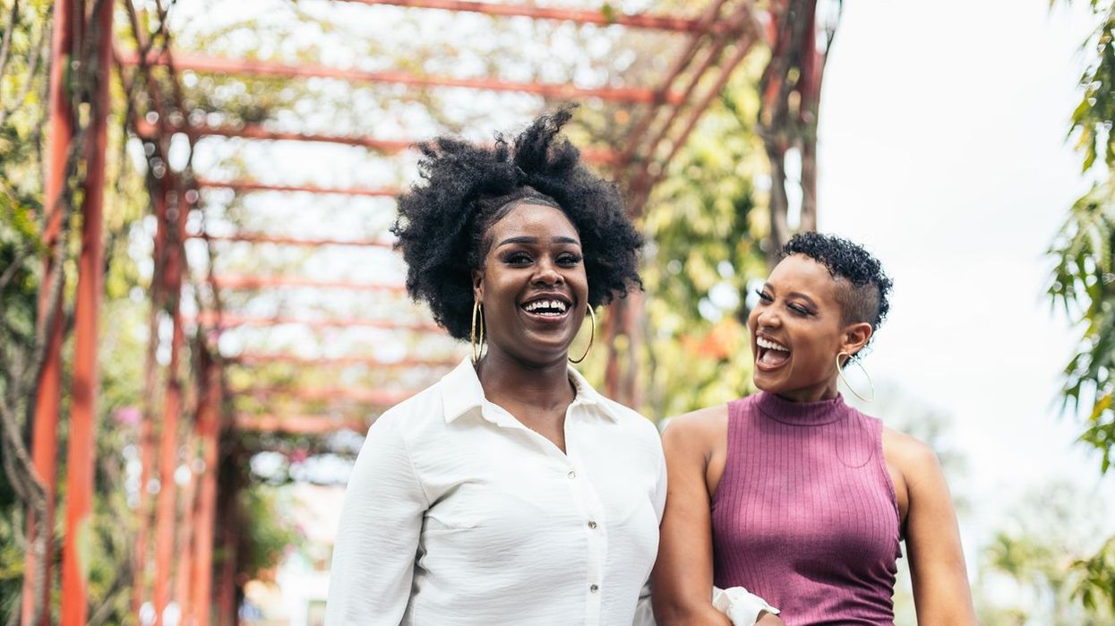 women stylish friends having fun walking in a park