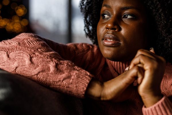 worried young woman lounging on the sofa