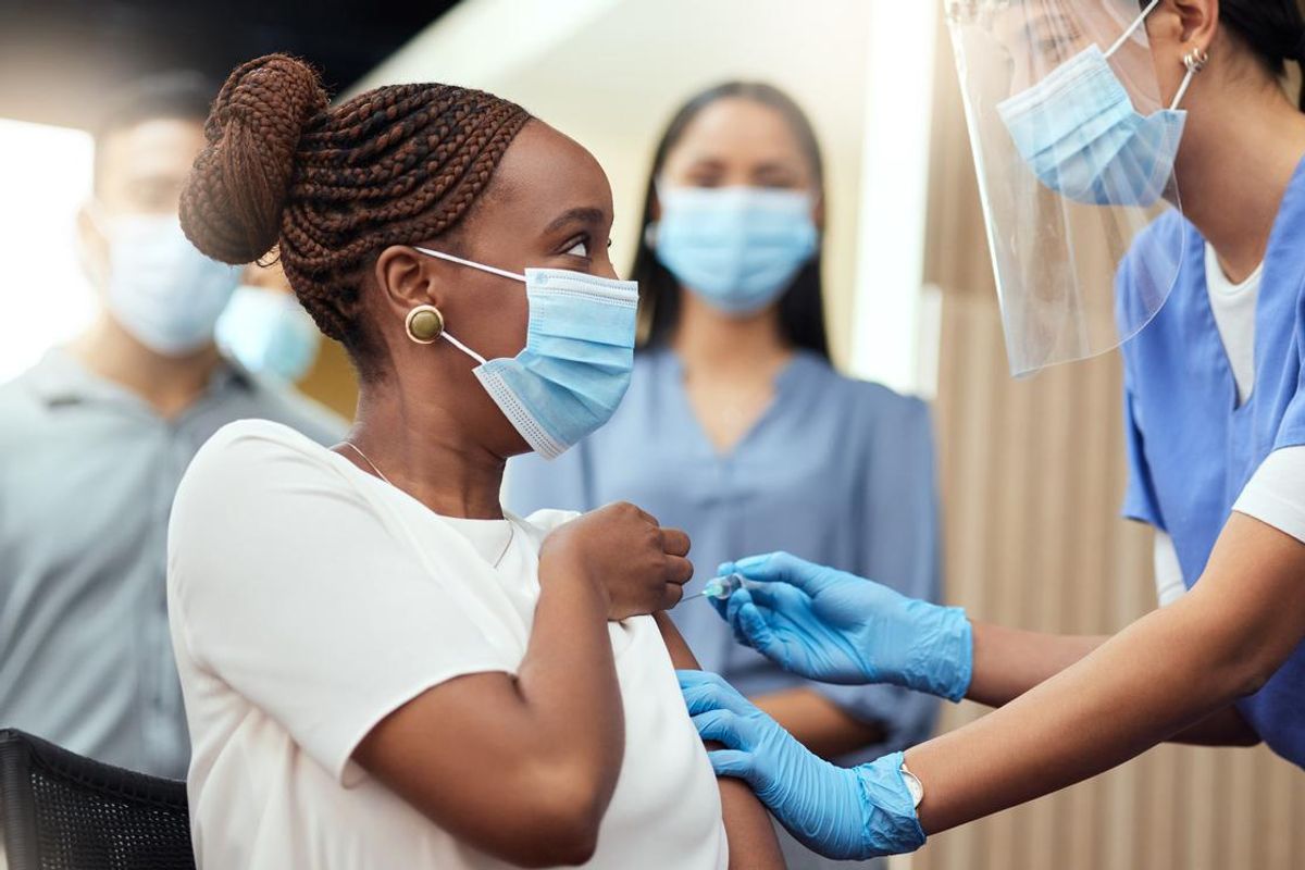 young businesswoman getting her covid vaccination