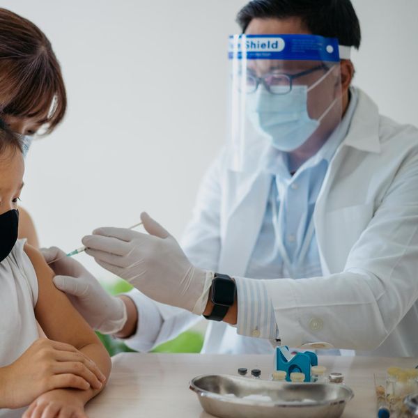 Young girl getting a vaccine to help with herd immunity