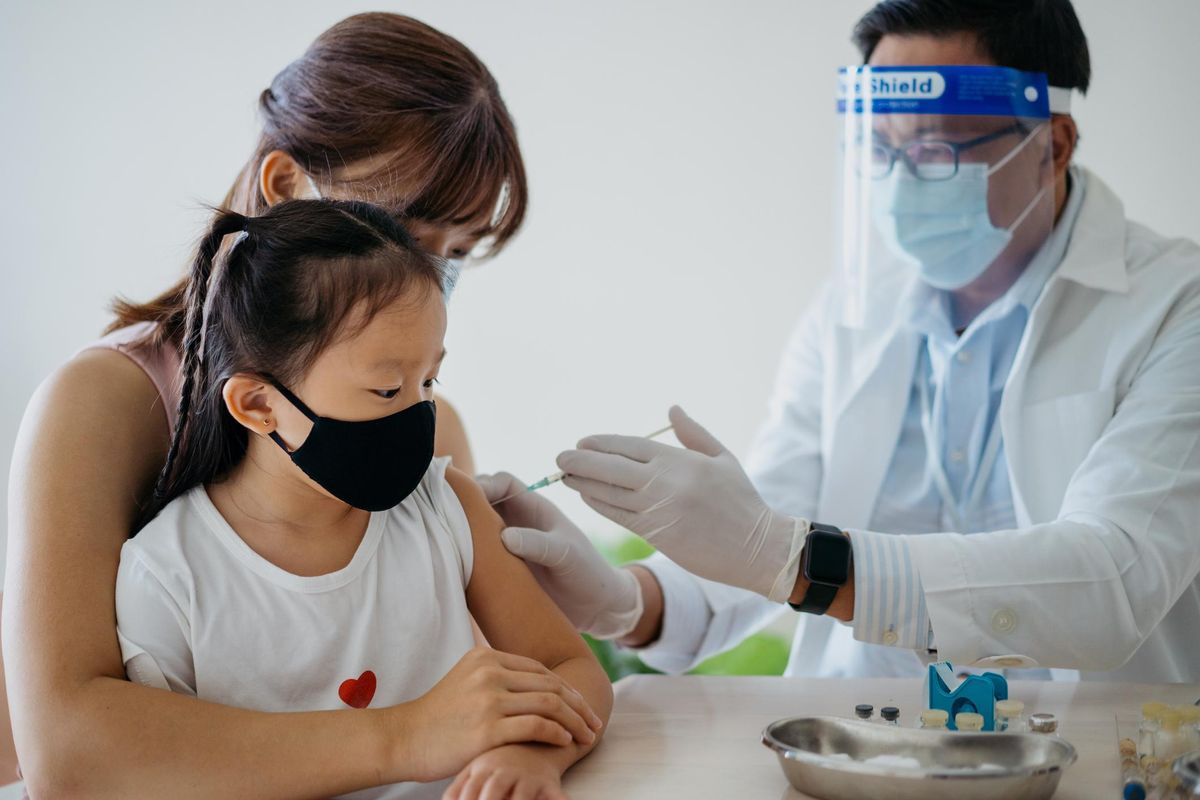 Young girl getting a vaccine
