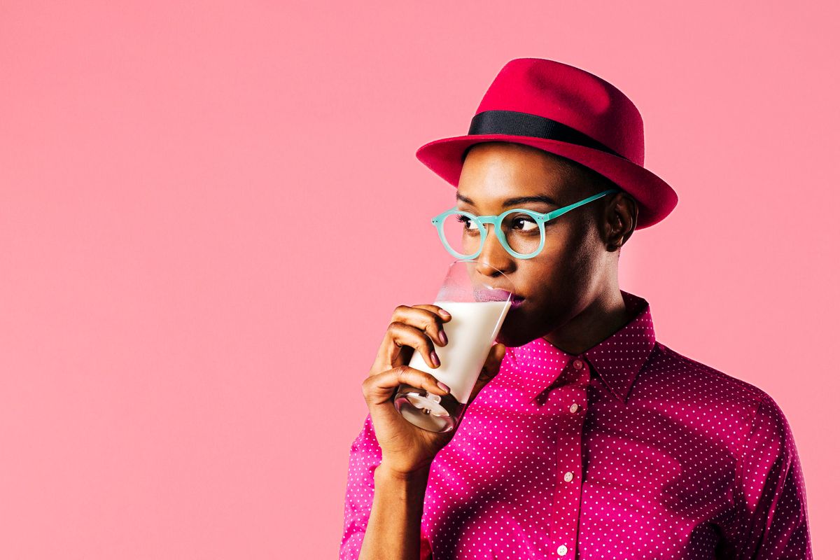 young woman drinking milk