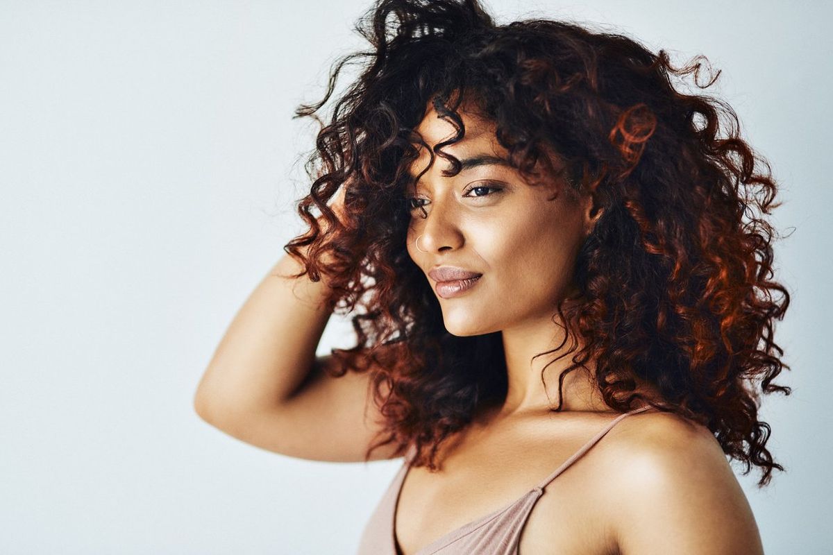 young woman playing with her hair