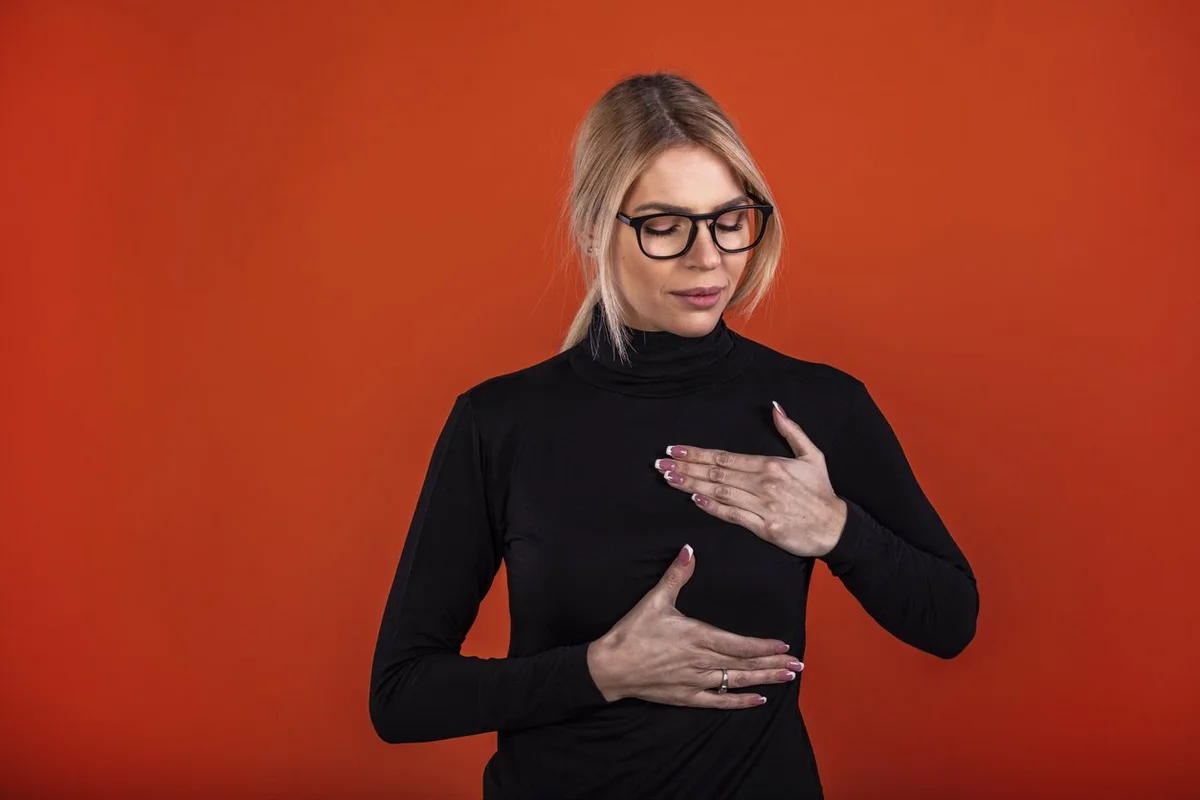 young woman with breast implant problems