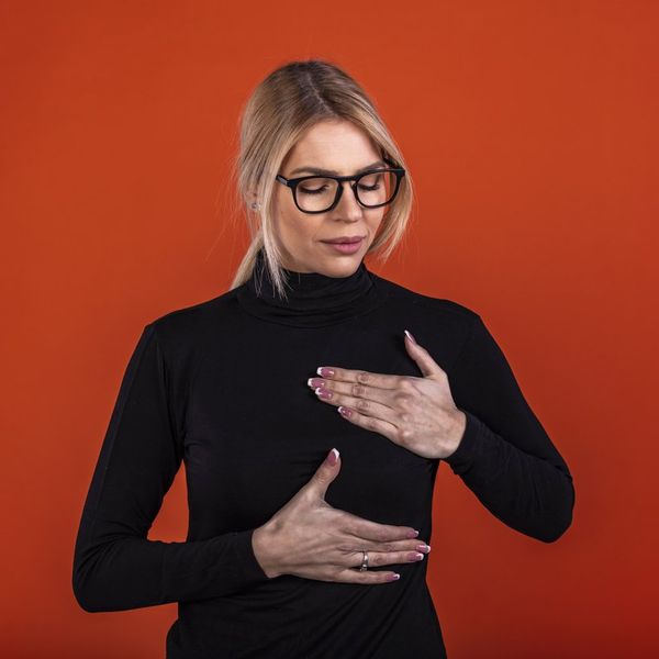 young woman with breast implant problems